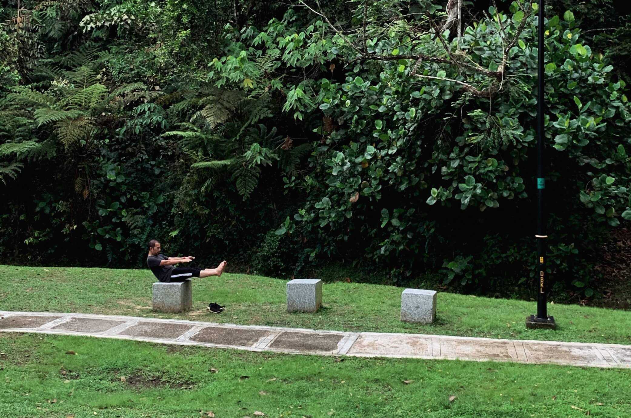 A person trying training core at the park.